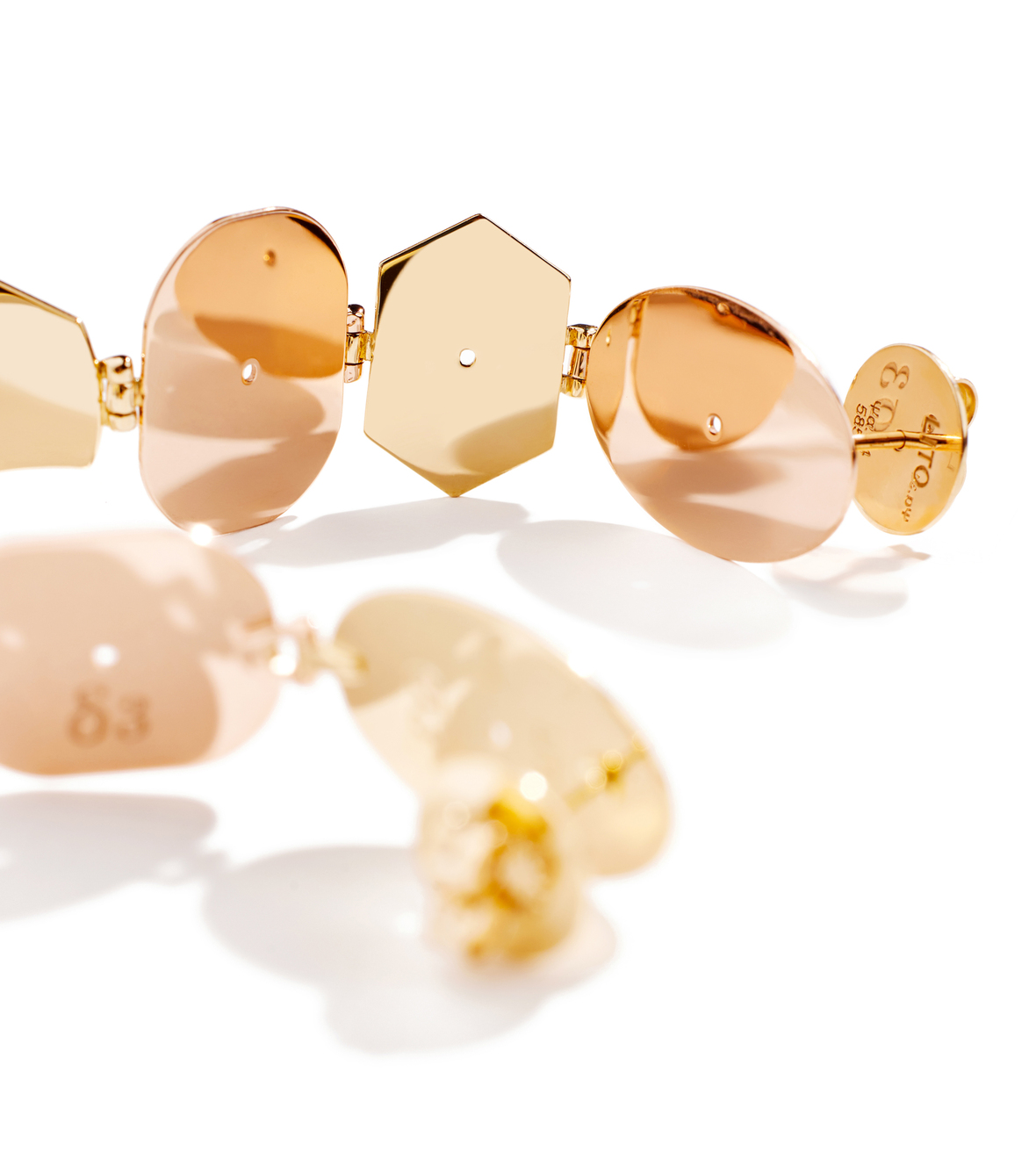 Multi shaped pair of earrings