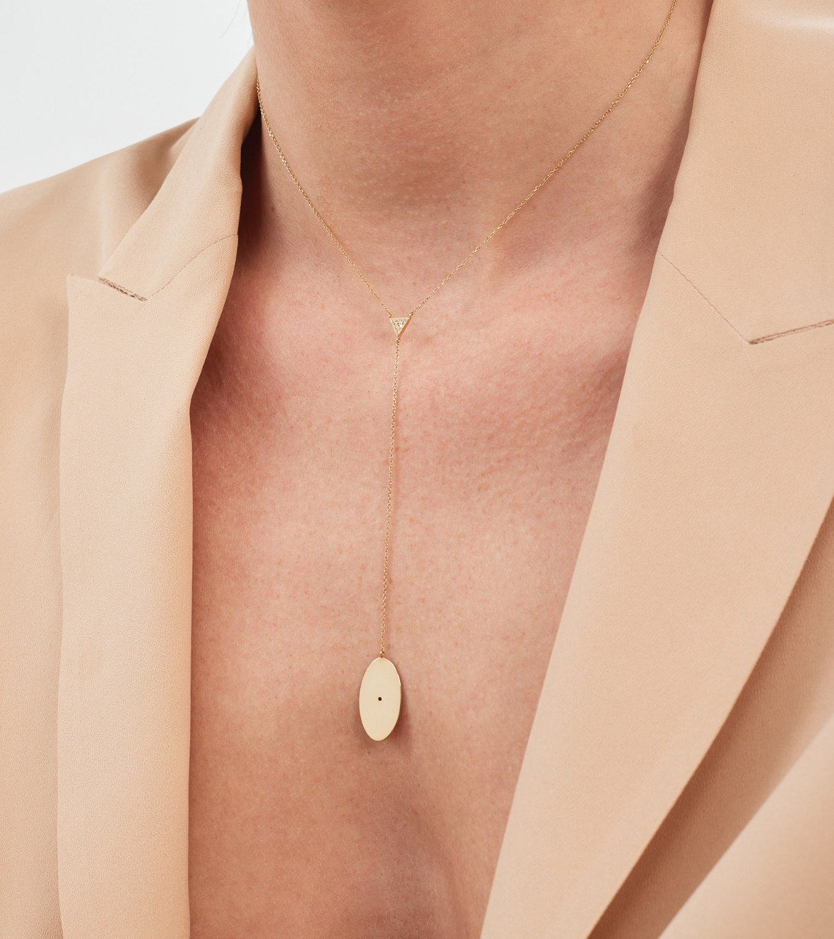 14K yellow gold "Mini Ellipse" necklace with a triangle of white brilliant cut Diamonds.
