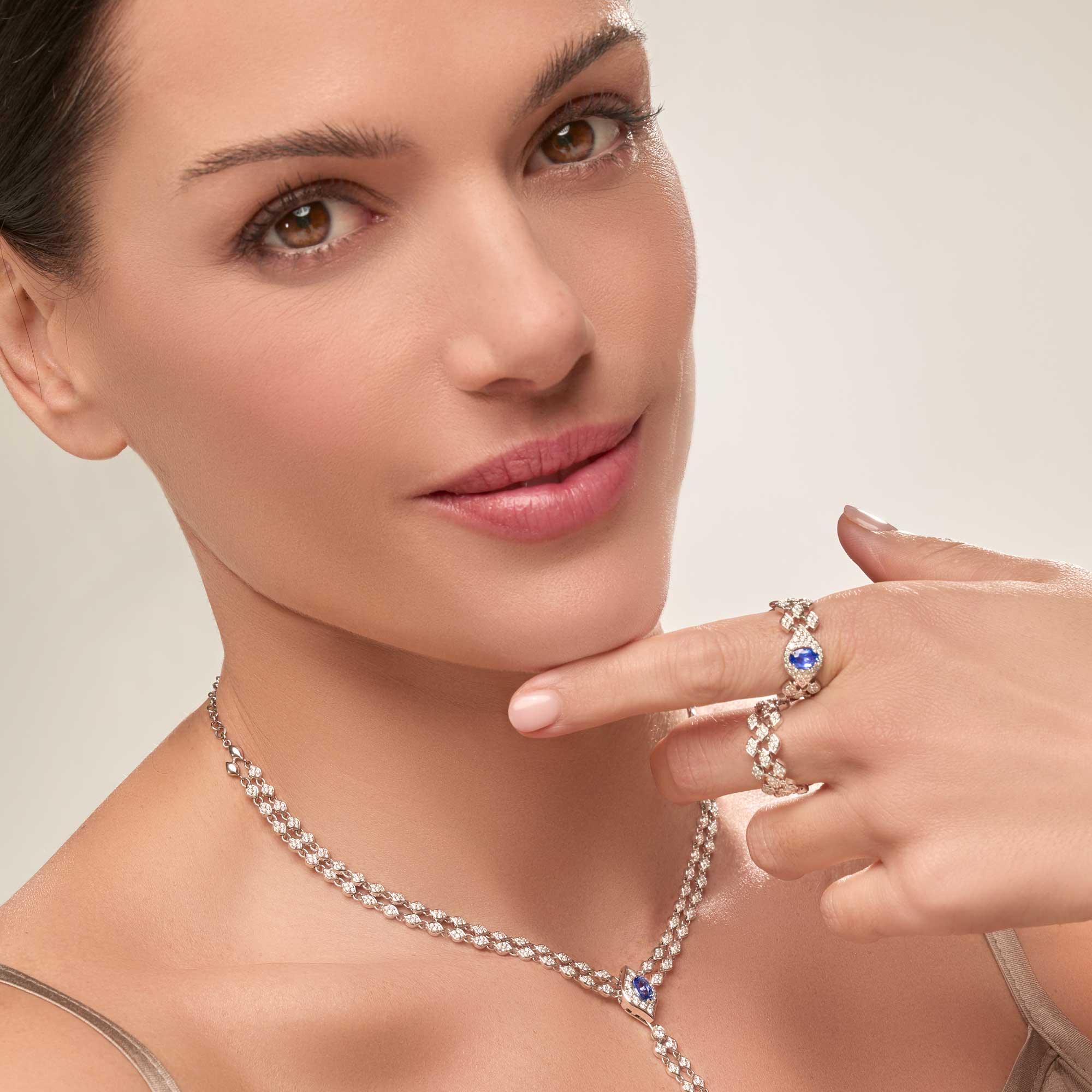 White gold 18k ring with brilliant diamonds and an oval blue sapphire by Casato